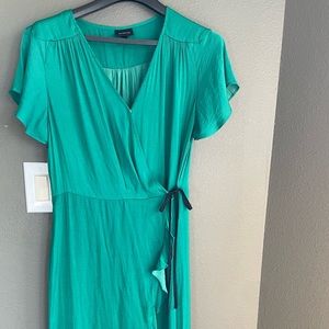 Green ruffle dress with tie at the waist